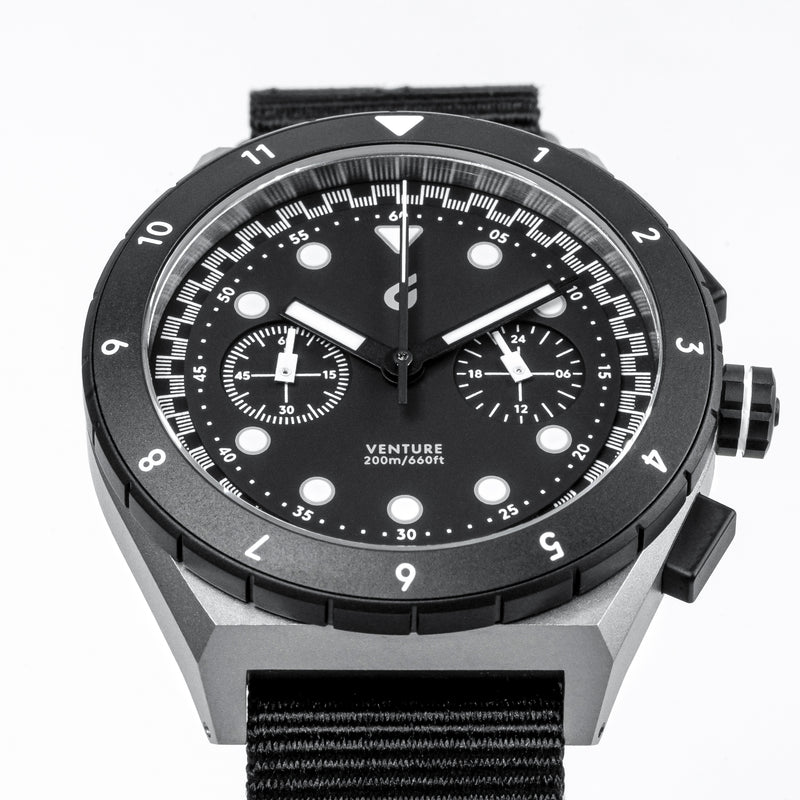 Macro angle of BOLDR Venture Velo Nocturne black bezel and bicompax dial